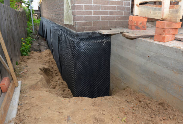 SJ Waterproofing Pros technician performing targeted Emergency Waterproofing assessment in Hollywood, MD